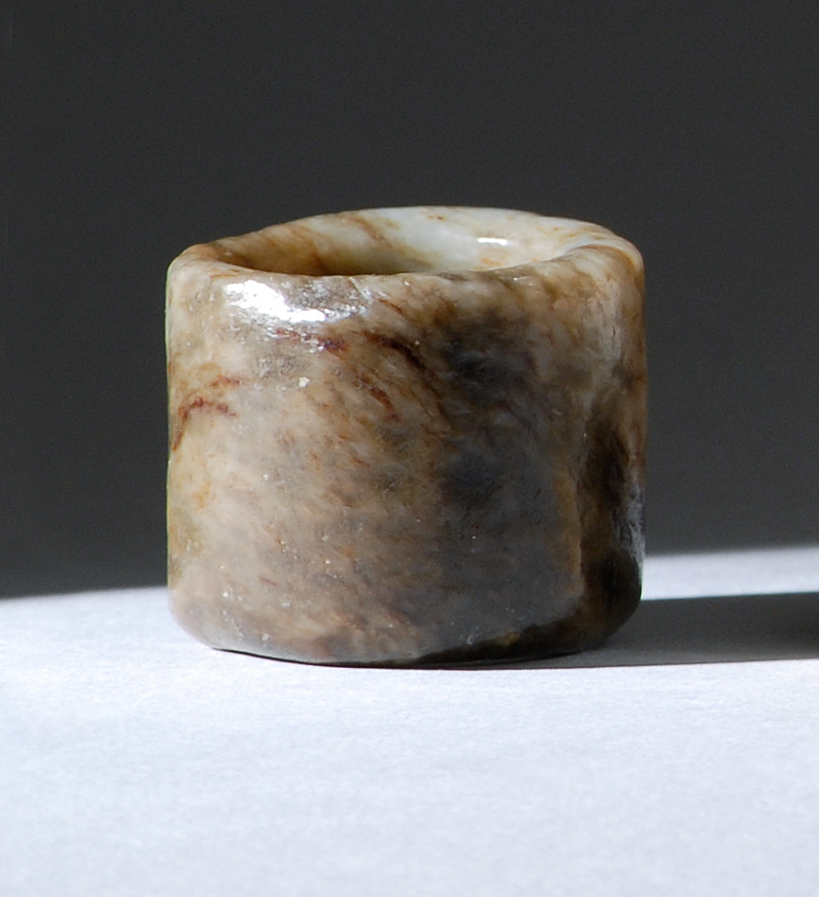 Appraisal: BROWN AND GRAY MUTTON-FAT JADE SCHOLAR'S RING Ming DynastyIn cylinder