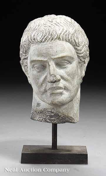 Appraisal: A Roman Granite Head after the Antique finely modeled minor