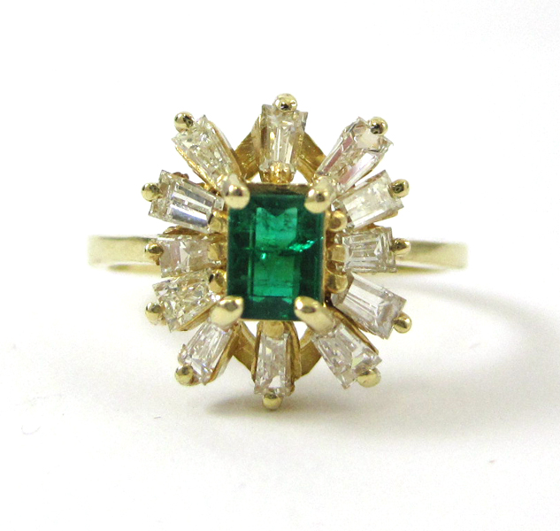 Appraisal: FOURTEEN KARAT GOLD EMERALD AND DIAMOND RING having twelve baguette