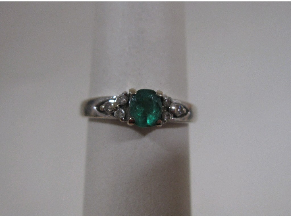 Appraisal: Eighteen carat white gold emerald and diamond set dress ring