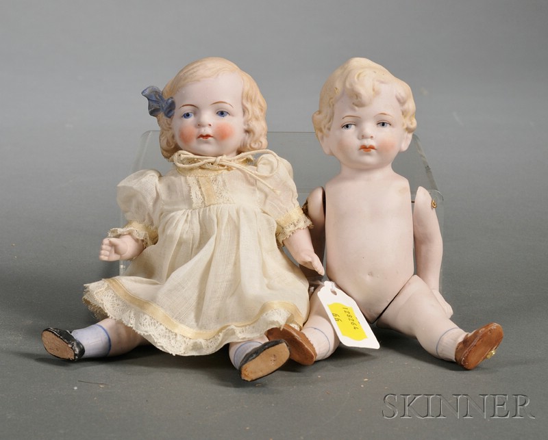 Appraisal: Pair of Large Pink All-Bisque Dolls with closed mouths painted