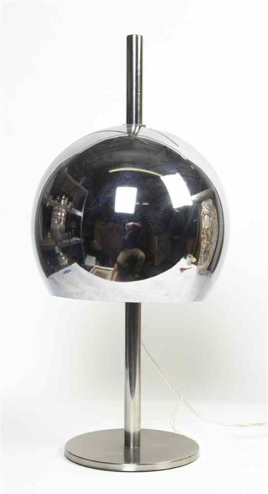 Appraisal: A Chrome Table Lamp the globe form shade over a