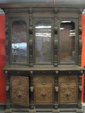 Appraisal: Highly Carved th Cent Oak Bookcase Cabinet glass doors over