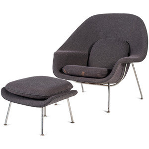 Appraisal: A Mid-Century Modern Womb Chair and Ottoman in the style