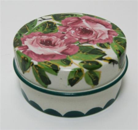 Appraisal: WEMYSS LOW POMADE JAR COVER EARLY TH CENTURY decorated by