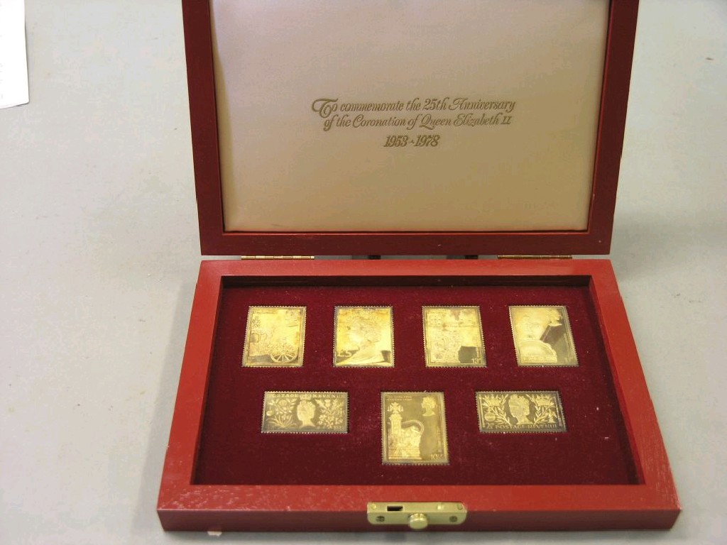 Appraisal: A set of six royal commemorative silver-gilt stamps cased