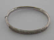 Appraisal: An Italian carat white gold and diamond bangle with a