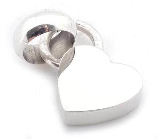 Appraisal: A SILVER HEART AND RING PENDANT