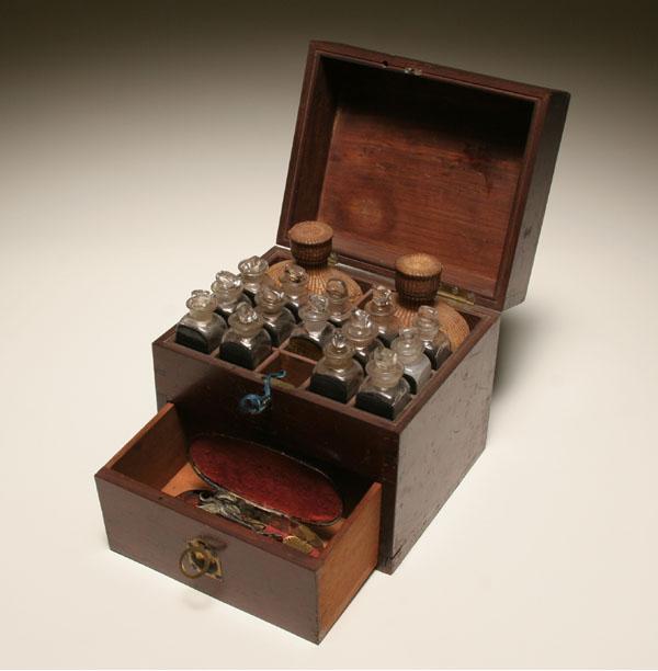 Appraisal: Eli Lilly pharmaceutical crate with distilled water bottle hinged top