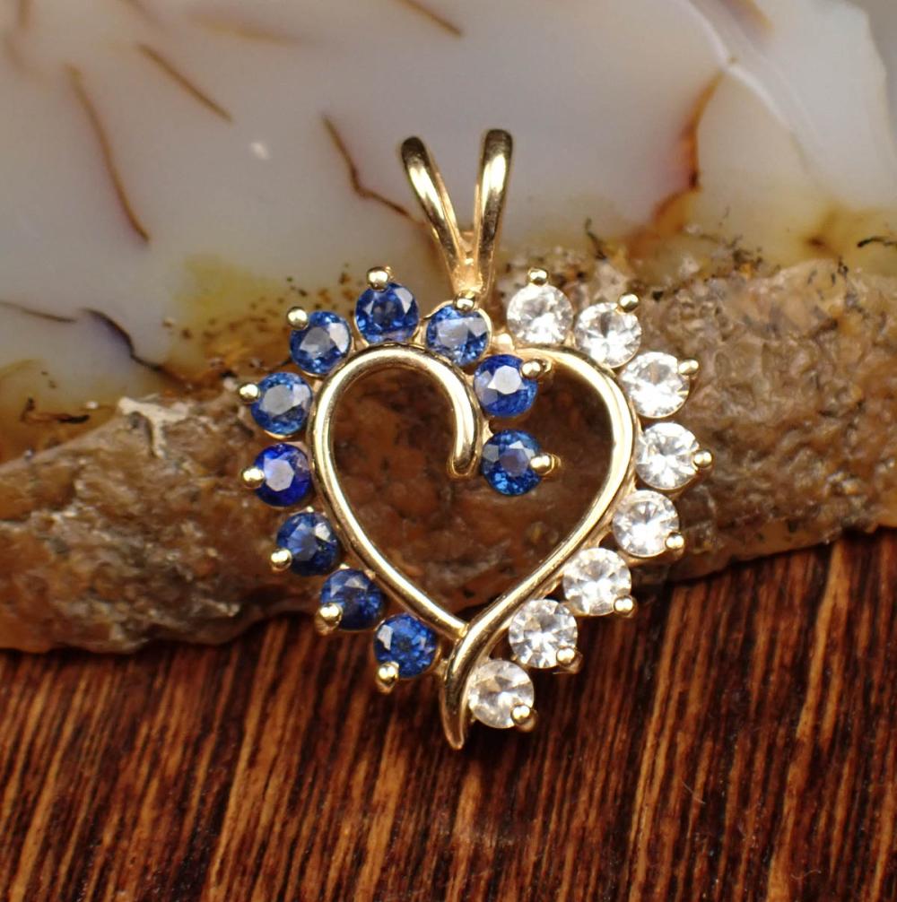 Appraisal: BLUE AND WHITE SAPPHIRE AND FOURTEEN KARAT GOLD PENDANT The