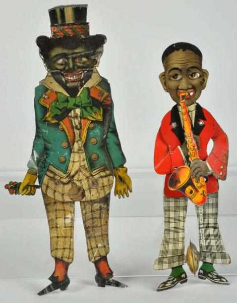 Appraisal: Lot of Tin Litho African-American Squeeze Toys Description German Includes