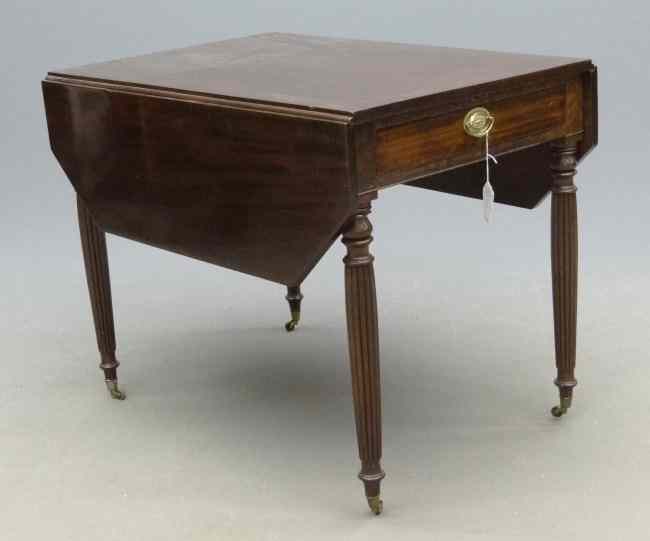 Appraisal: th c mahogany single drawer reeded leg shaped leaves Pembroke