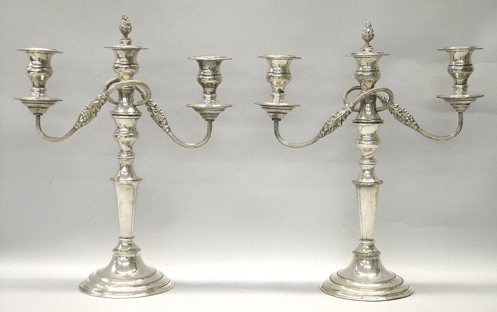 Appraisal: Pair of Sheffield plated three branch candelabra high