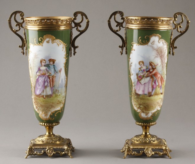 Appraisal: Pair of hand painted garniture urns Both urns feature one