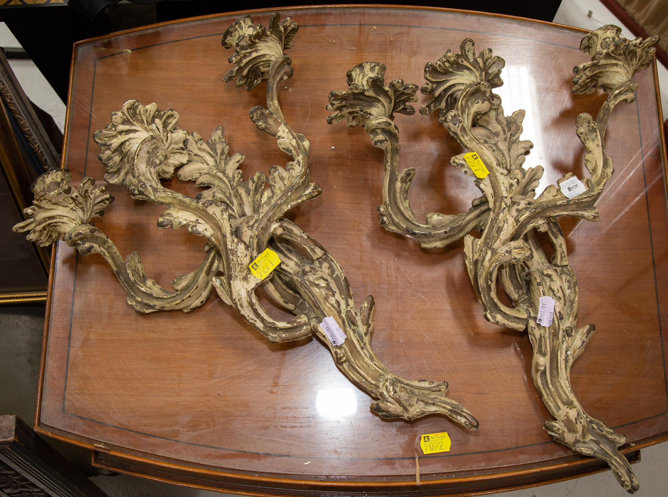 Appraisal: A PAIR OF ROCOCO STYLE BRASS CANDLE SCONCES st half