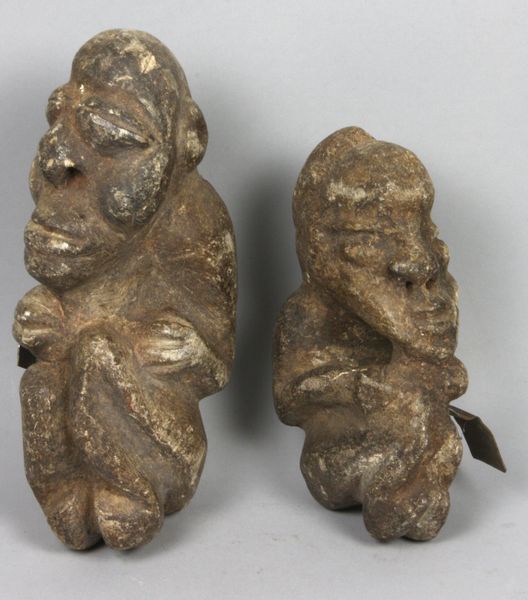 Appraisal: Two African carved limestone figures x largest Good condition EST