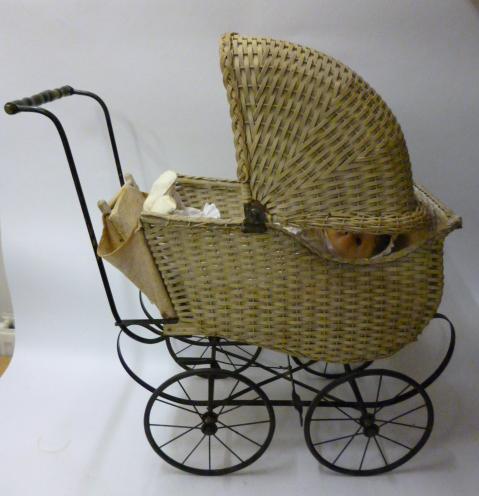 Appraisal: A 's doll's pram in cane work to hood and