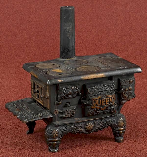 Appraisal: Dent cast iron Queen toy stove with a copper fl