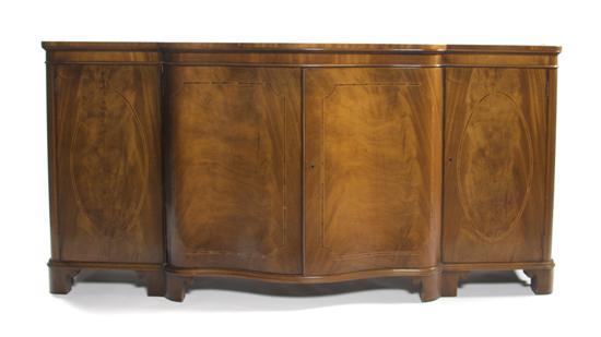 Appraisal: Mahogany Sideboard Baker the shaped serpentine top over four paneled