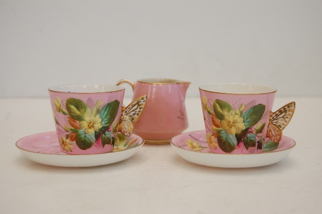 Appraisal: TH CENTURY PINK GROUND DEMI TASSE X WITH BUTTERFLY HANDLES