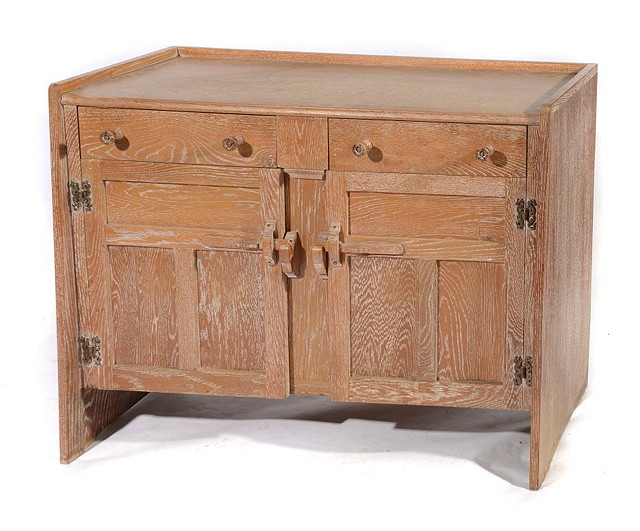 Appraisal: A TH CENTURY LIMED OAK SIDEBOARD with two short drawers