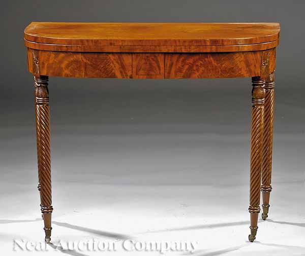 Appraisal: An American Classical Carved Mahogany Demilune Card Table early th