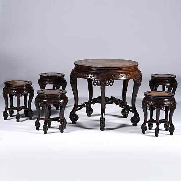 Appraisal: Chinese Carved Table and Stools Chinese An eighteenth-century style carved