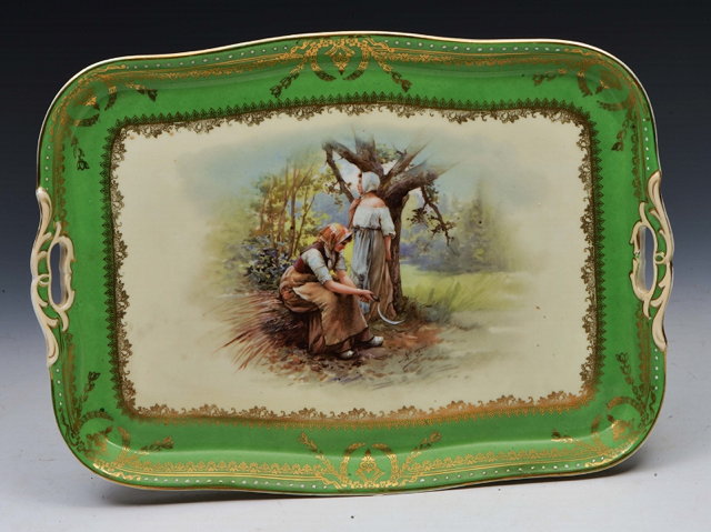 Appraisal: A CONTINENTAL RECTANGULAR PORCELAIN TRAY with pierced handles decorated with