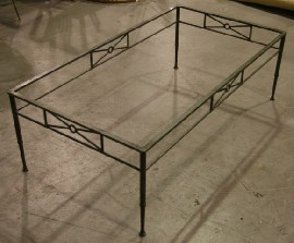 Appraisal: A wrought iron and glass topped coffee table cm long