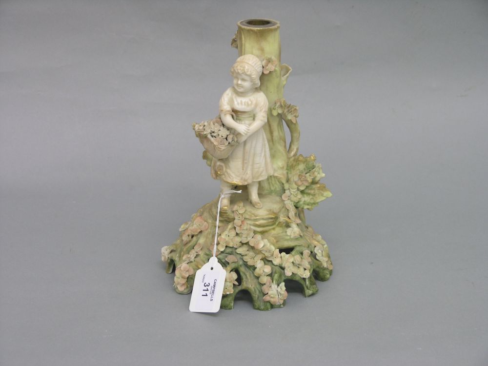 Appraisal: A Nautilus porcelain candelabra base modelled with a girl carrying