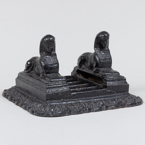 Appraisal: REGENCY BLACK-PAINTED CAST IRON BOOT SCRAPE WITH TWIN SPHINX HEADS