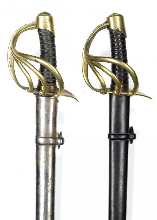 Appraisal: TWO FRENCH CUIRASSIERS with double fullered blade brass four-bar hilt