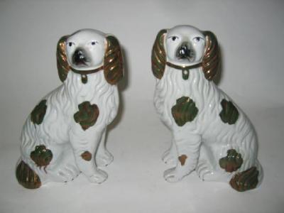 Appraisal: A PAIR OF STAFFORDSHIRE POTTERY MODELS OF SPANIELS with free