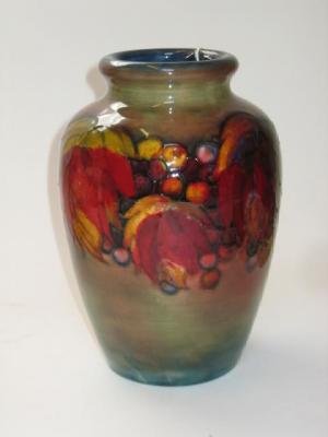 Appraisal: A MOORCROFT POTTERY FLAMBE VASE of ovoid form tube lined