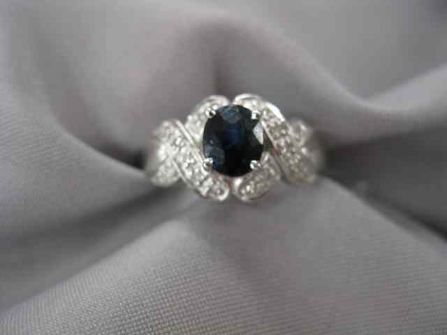 Appraisal: Sapphire Diamond Ring carat deep blue sapphire surrounded by diamonds