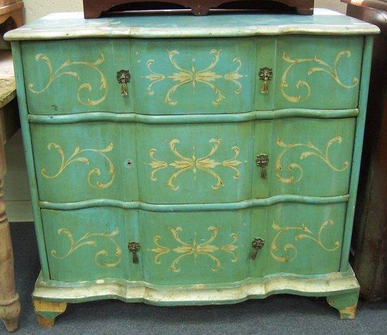 Appraisal: A painted and decorated pine chest with serpentine front fitted