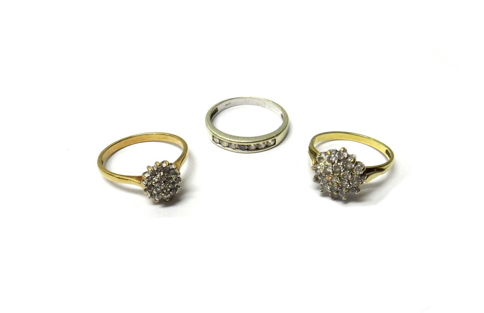 Appraisal: A ct gold and diamond set oval cluster ring claw