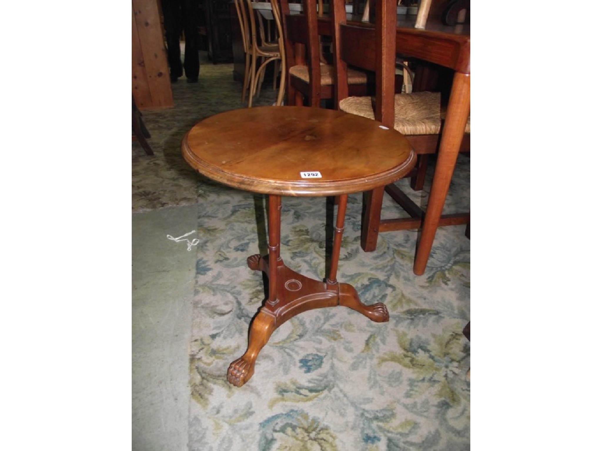 Appraisal: A small walnut occasional table of circular form with moulded