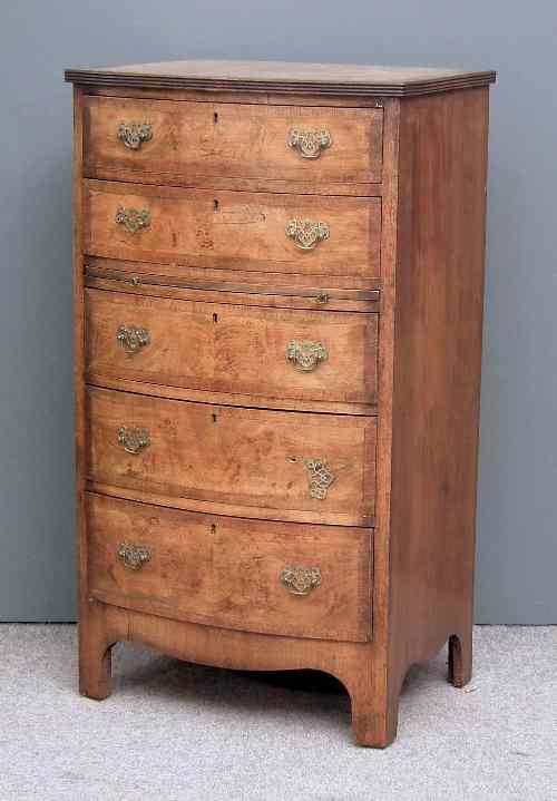 Appraisal: A s walnut bow-front chest of drawers the crossbanded with