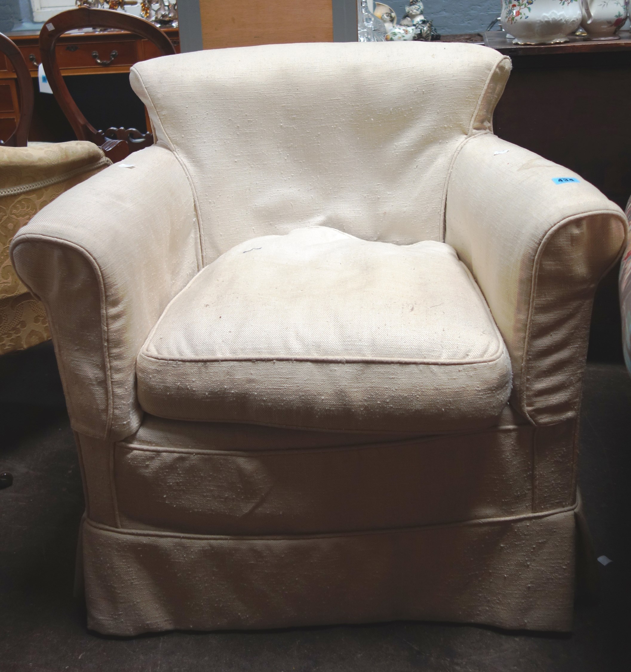 Appraisal: An early th century button down upholstered armchair with loose