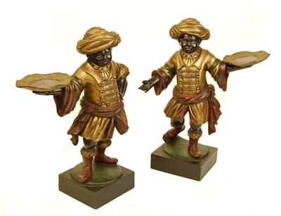 Appraisal: A pair of carved wood and polychrome decorated Blackamoor's each