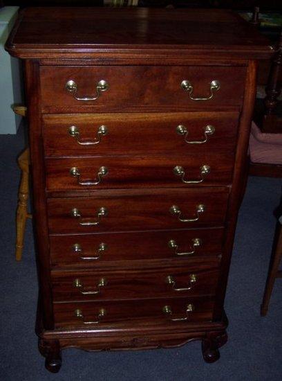 Appraisal: A th Century Wellington chest of four drawers behind false