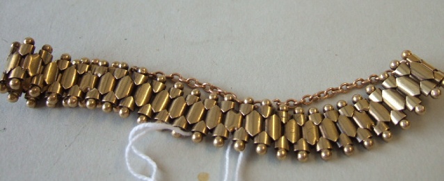 Appraisal: A Victorian gold bracelet in an oval section tubular and