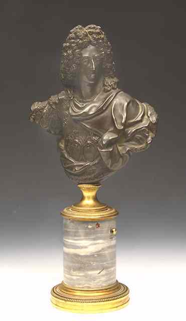 Appraisal: A BRONZE BUST of Louis XIV on a turned brass