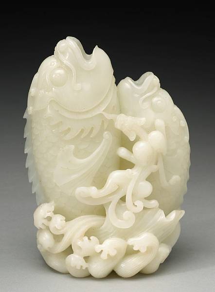 Appraisal: A white jade double fish vase th Century Shaped as