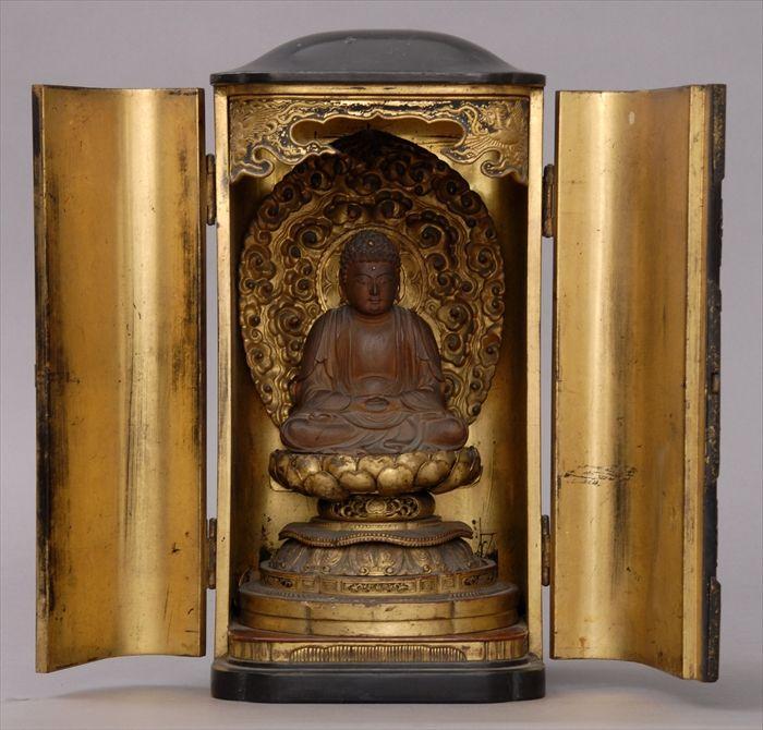 Appraisal: CHINESE BRASS-MOUNTED BLACK LACQUER HOUSEHOLD SHRINE The doors with lotus-engraved