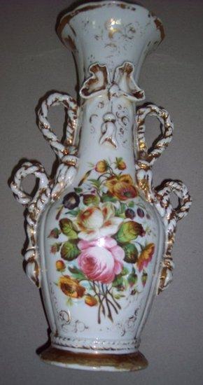 Appraisal: A Continental floral vase with rope handles and ribbon type