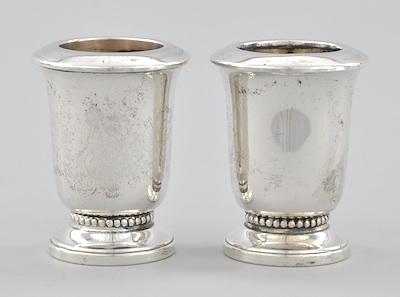 Appraisal: A Pair of Weighted Sterling Silver Cigarette Holders The urn