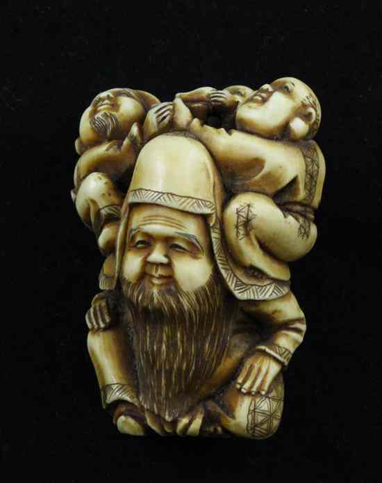 Appraisal: A Meiji period ivory netsuke carved as Fukurokuju carrying three