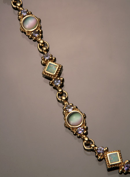 Appraisal: -Karat Yellow-Gold Cat's Eye Tanzanite and Black Opal Doublet Bracelet